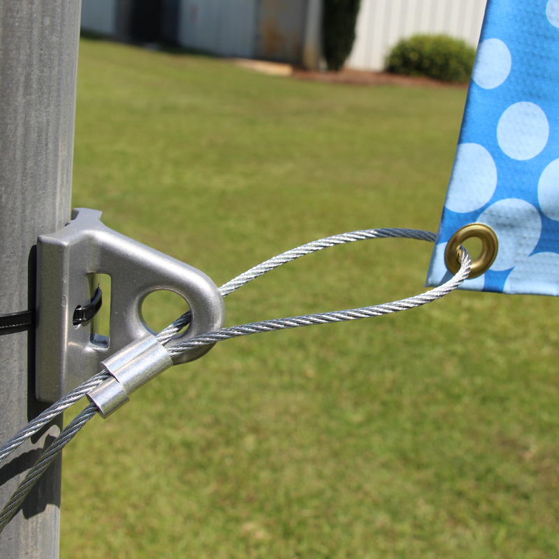 Banner with Galvanized cable and ferrule stop on tie-down bracket and zip ties